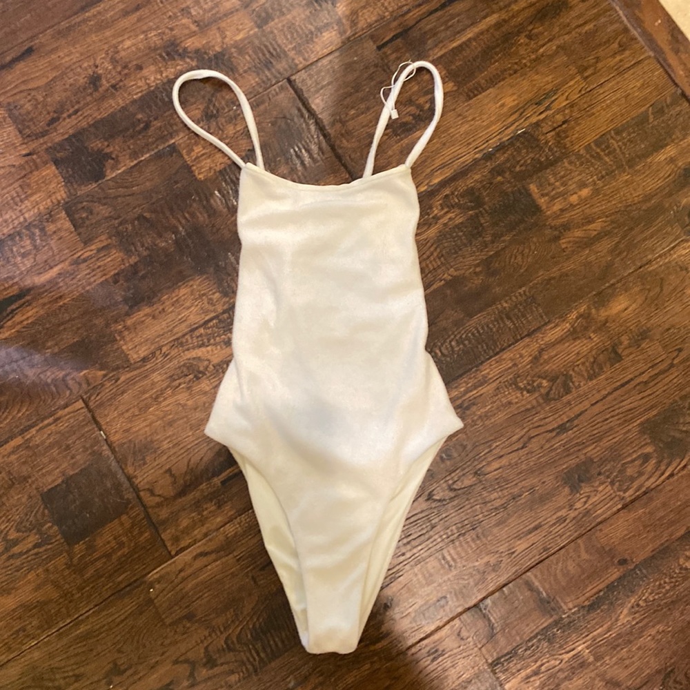 White one piece, terry cloth bikini with cute back straps